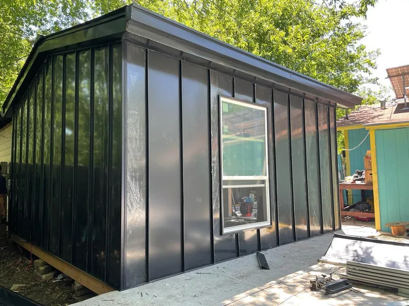Black standing seam metal wall panels for Roof Inspection in Inverness
